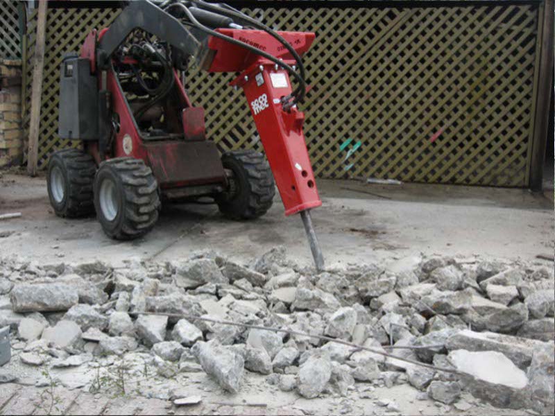 Dingo Mini Digger in action - Demolishing a Concrete Slab for Removal